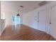 Open living area features hardwood floors and access to a screened-in lanai at 6150 Sw 103Rd Loop, Ocala, FL 34476