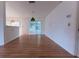 Spacious living room with hardwood floors and access to a screened-in lanai at 6150 Sw 103Rd Loop, Ocala, FL 34476
