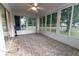 Sunroom with tiled floor and large windows, perfect for enjoying natural light and outdoor views at 6150 Sw 103Rd Loop, Ocala, FL 34476