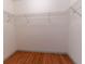 Empty walk-in closet with wood flooring and wire shelving at 6150 Sw 103Rd Loop, Ocala, FL 34476