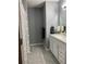 Well-lit bathroom with a shower and vanity, creating a clean and functional space at 6432 Nw 64Th Ter, Ocala, FL 34482