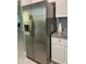 Stainless steel refrigerator with water dispenser, located next to the kitchen counter at 6432 Nw 64Th Ter, Ocala, FL 34482