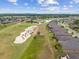 A high aerial view showing a golf course and the houses surrounding a long, winding lake at 6816 Sw 95Th Cir, Ocala, FL 34481