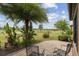 Paver patio area with seating, complemented by tropical plants and expansive golf course views at 6816 Sw 95Th Cir, Ocala, FL 34481