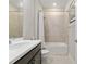 Bright bathroom featuring a shower and bath combination, clean lines, and neutral tile at 6816 Sw 95Th Cir, Ocala, FL 34481