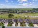 Aerial view of a community with a golf course surrounded by well-maintained homes and lush landscaping at 6816 Sw 95Th Cir, Ocala, FL 34481