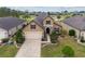 Beautiful home boasts manicured landscaping, a paver driveway, and a welcoming front entrance at 6816 Sw 95Th Cir, Ocala, FL 34481