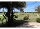 Lush backyard with a view of the beautiful golf course and serene community at 6816 Sw 95Th Cir, Ocala, FL 34481
