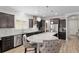 Kitchen with stainless steel appliances, gray countertops, lots of cabinets and a breakfast bar with seating at 6816 Sw 95Th Cir, Ocala, FL 34481