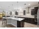 Kitchen with stainless steel appliances, gray countertops, lots of cabinets and a breakfast bar with seating at 6816 Sw 95Th Cir, Ocala, FL 34481