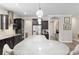 Kitchen with stainless steel appliances, gray countertops, lots of cabinets and a breakfast bar with seating at 6816 Sw 95Th Cir, Ocala, FL 34481