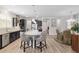 Kitchen with stainless steel appliances, gray countertops, lots of cabinets and a breakfast bar with seating at 6816 Sw 95Th Cir, Ocala, FL 34481