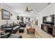 Spacious living room with a ceiling fan and an open layout that connects to the kitchen and dining area at 6816 Sw 95Th Cir, Ocala, FL 34481