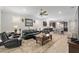 Spacious living room area that connects to kitchen, hardwood floors and a ceiling fan at 6816 Sw 95Th Cir, Ocala, FL 34481