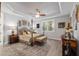 Bedroom with decorative ceiling, ceiling fan, large rug, and natural light from the windows at 6816 Sw 95Th Cir, Ocala, FL 34481