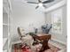 Bright office space featuring a window, ceiling fan and a bookcase at 6816 Sw 95Th Cir, Ocala, FL 34481