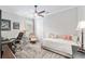Inviting home office with a ceiling fan, daybed, desk and leather chairs for comfortable working at 6816 Sw 95Th Cir, Ocala, FL 34481