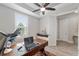 Office space features desk with laptop, a window and a treadmill at 6816 Sw 95Th Cir, Ocala, FL 34481