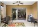 Open sliding glass doors connect sunroom to home creating a seamless transition at 6816 Sw 95Th Cir, Ocala, FL 34481