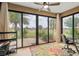Sunroom with sliding glass doors overlooking lush golf course views at 6816 Sw 95Th Cir, Ocala, FL 34481
