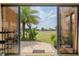 View through the sliding glass doors of the golf course in backyard at 6816 Sw 95Th Cir, Ocala, FL 34481