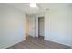 A bedroom with wood floors, a ceiling fan, and an open closet at 7249 Sw 93Rd Ave, Ocala, FL 34481
