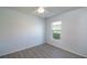 Bright bedroom featuring a ceiling fan and a window overlooking a green outdoor space at 7249 Sw 93Rd Ave, Ocala, FL 34481