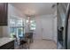 Bright breakfast nook with a dark wood table and two windows providing natural light at 7249 Sw 93Rd Ave, Ocala, FL 34481