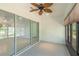 Enclosed patio with a ceiling fan and windows, providing access to natural light at 7249 Sw 93Rd Ave, Ocala, FL 34481