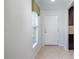 Bright entryway features neutral colors, tile flooring and a clear view of the front door at 7249 Sw 93Rd Ave, Ocala, FL 34481