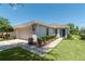 Well-maintained exterior showcasing a lovely home with a manicured lawn at 7249 Sw 93Rd Ave, Ocala, FL 34481