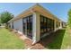Exterior side view of the house featuring well-maintained landscaping and windows at 7249 Sw 93Rd Ave, Ocala, FL 34481