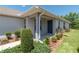 Inviting front entrance featuring a covered porch and tasteful landscaping at 7249 Sw 93Rd Ave, Ocala, FL 34481