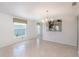 Bright living area with an opening to the kitchen and natural light from surrounding windows at 7249 Sw 93Rd Ave, Ocala, FL 34481