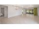 Spacious living room with tile floors and sliding glass doors leading to the enclosed patio at 7249 Sw 93Rd Ave, Ocala, FL 34481