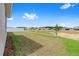 Wide shot of the backyard and greenbelt area, community homes in the background at 7827 Sw 56Th Pl, Ocala, FL 34474