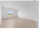 Bright bedroom with tile flooring and a window providing natural light and views at 7827 Sw 56Th Pl, Ocala, FL 34474