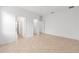 Spacious bedroom with tile flooring and three doorways at 7827 Sw 56Th Pl, Ocala, FL 34474