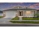Charming single-story home featuring a two-car garage and a well-manicured lawn at 7827 Sw 56Th Pl, Ocala, FL 34474