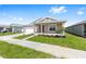 Attractive single-story home featuring a well-kept lawn and a covered front porch with columns at 7827 Sw 56Th Pl, Ocala, FL 34474