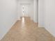 Spacious hallway with tile flooring leading to the main living areas at 7827 Sw 56Th Pl, Ocala, FL 34474