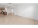 Spacious living area with tile flooring leading to a kitchen in the background at 7827 Sw 56Th Pl, Ocala, FL 34474