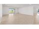 Open living space with tiled floors, leading to patio with views to backyard at 7827 Sw 56Th Pl, Ocala, FL 34474