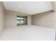 Covered back patio featuring a sliding glass door and concrete flooring at 7827 Sw 56Th Pl, Ocala, FL 34474