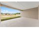View of a covered patio overlooking a large green space and other community homes at 7827 Sw 56Th Pl, Ocala, FL 34474