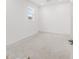 Bright room featuring concrete floors, a window with blinds, and white walls with recessed lighting at 7827 Sw 56Th Pl, Ocala, FL 34474