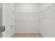Bright walk-in closet with wire shelving and tile flooring at 7827 Sw 56Th Pl, Ocala, FL 34474