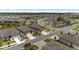 Residential neighborhood, viewed from above, features well-kept homes, manicured lawns, and orderly street layout at 9063 Sw 59Th Lane Rd, Ocala, FL 34481