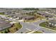 The aerial view reveals a community with well-manicured lawns, tree-lined streets, and a consistent architectural style at 9063 Sw 59Th Lane Rd, Ocala, FL 34481