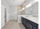 Modern bathroom featuring a glass enclosed shower, double sinks and tile flooring at 9063 Sw 59Th Lane Rd, Ocala, FL 34481